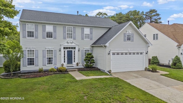 10 Butternut Ln, Bayville, NJ 08721 - colonial house featuring concrete driveway, a front lawn, and roof with shingles