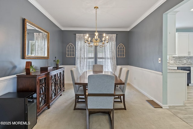 10 Butternut Ln, Bayville, NJ 08721 - dining room with a chandelier, ornamental molding, and light carpet