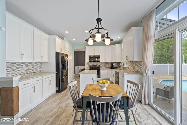 10 Butternut Ln, Bayville, NJ 08721 - kitchen featuring appliances with stainless steel finishes, a sink, white cabinets, tasteful backsplash, and recessed lighting