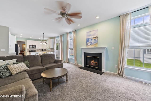 10 Butternut Ln, Bayville, NJ 08721 - living area with a ceiling fan, recessed lighting, a fireplace with flush hearth, carpet, and baseboards