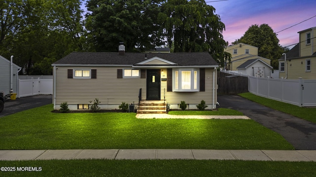 69 Helen Ave, Freehold, NJ 07728 - bungalow-style house with driveway and a chimney