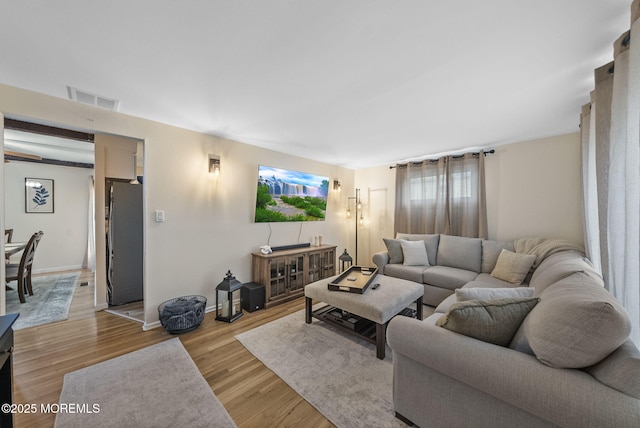 69 Helen Ave, Freehold, NJ 07728 - living room featuring light wood finished floors and baseboards
