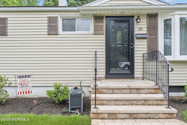 69 Helen Ave, Freehold, NJ 07728 - property entrance featuring a chimney