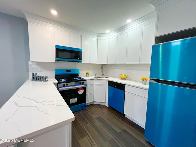 35 Wycoff Way E Unit 35, East Brunswick, NJ 08816 - kitchen featuring stainless steel appliances, a sink, decorative backsplash, light stone counters, and dark wood-style floors