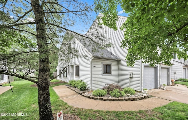 70 Lexington Cir, Matawan, NJ 07747 - view of home's exterior with a shingled roof, a lawn, and driveway