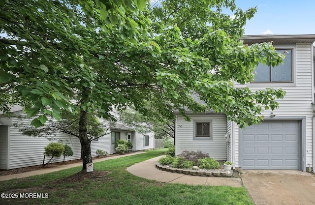 70 Lexington Cir, Matawan, NJ 07747 - view of property hidden behind natural elements featuring an attached garage and concrete driveway