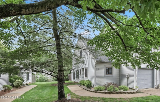 70 Lexington Cir, Matawan, NJ 07747 - view of home's exterior with roof with shingles, a yard, and an attached garage