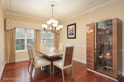 118 Timber Hill Dr, Monroe, NJ 08831 - dining space featuring crown molding, dark wood-style floors, a chandelier, and baseboards