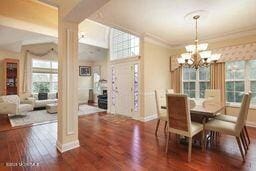 118 Timber Hill Dr, Monroe, NJ 08831 - dining area featuring wood finished floors, a chandelier, and baseboards