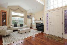 118 Timber Hill Dr, Monroe, NJ 08831 - foyer featuring wood finished floors, a fireplace, and high vaulted ceiling