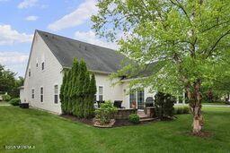 118 Timber Hill Dr, Monroe, NJ 08831 - back of house featuring a yard