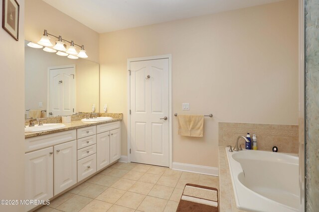 118 Timber Hill Dr, Monroe, NJ 08831 - bathroom with double vanity, a garden tub, tile patterned flooring, and baseboards
