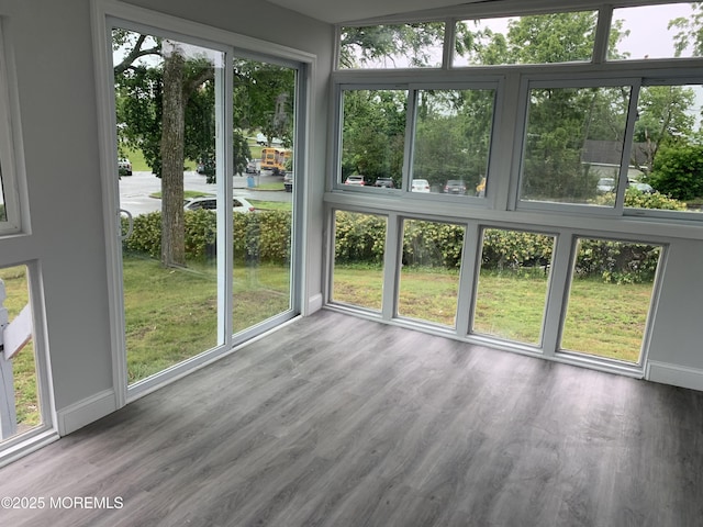 219 Hyers St, Toms River, NJ 08753 - unfurnished sunroom featuring baseboards and wood finished floors