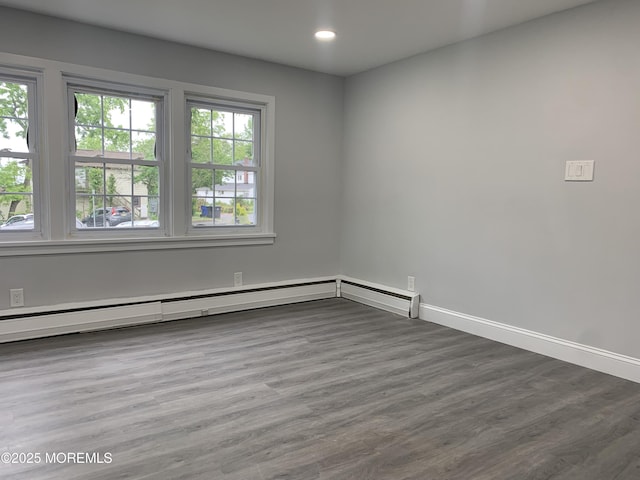 219 Hyers St, Toms River, NJ 08753 - spare room featuring wood finished floors, recessed lighting, baseboards, and baseboard heating