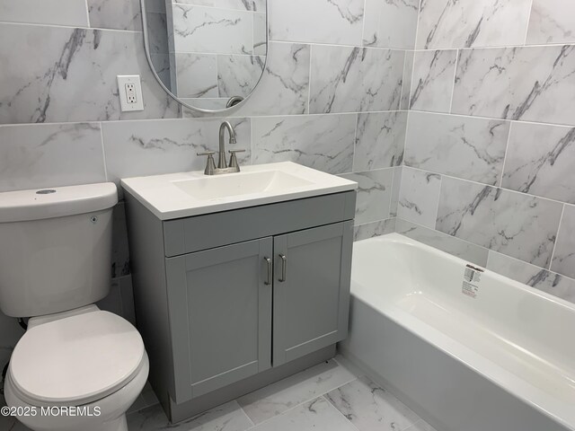 219 Hyers St, Toms River, NJ 08753 - full bathroom with toilet, vanity, tile walls, and marble look tiles