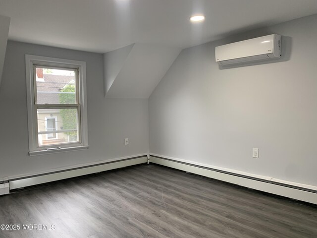 219 Hyers St, Toms River, NJ 08753 - bonus room with a wall mounted air conditioner, recessed lighting, wood finished floors, and lofted ceiling