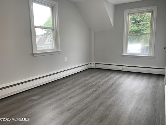 219 Hyers St, Toms River, NJ 08753 - additional living space featuring wood finished floors, a baseboard radiator, and vaulted ceiling