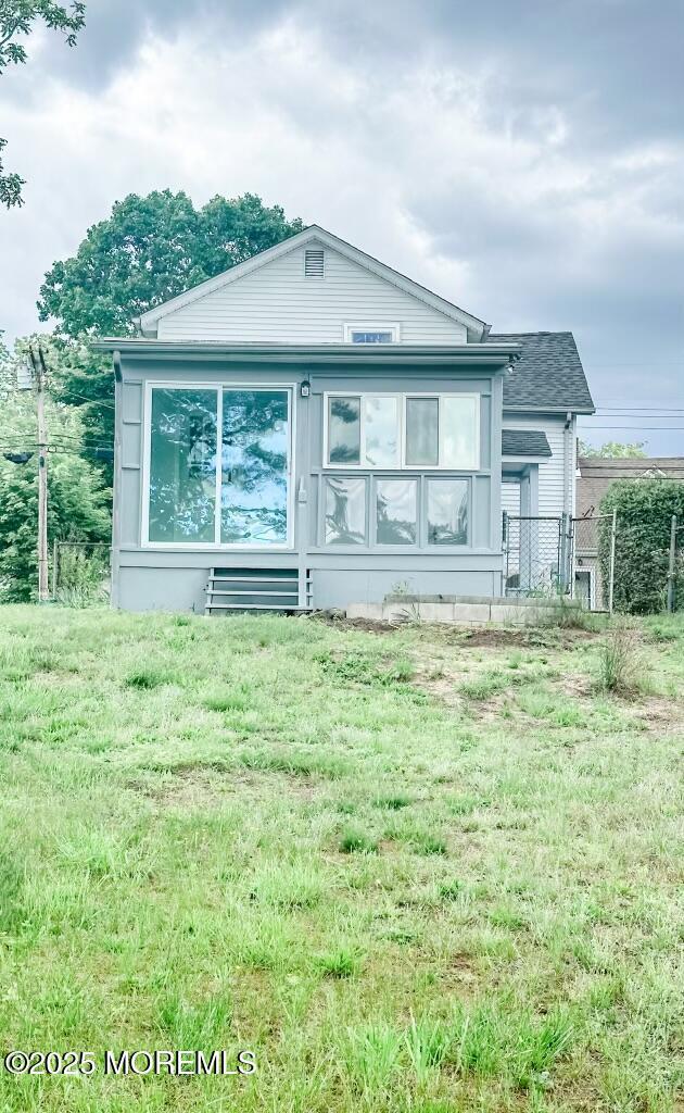219 Hyers St, Toms River, NJ 08753 - view of front facade with a sunroom