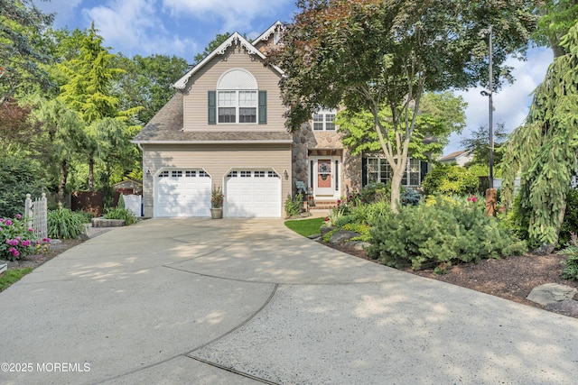 26 Derringer Dr, Howell, NJ 07731 - view of front facade with concrete driveway, an attached garage, and stone siding