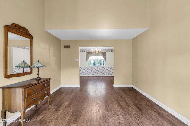 26 Derringer Dr, Howell, NJ 07731 - empty room featuring wood finished floors, a chandelier, and baseboards
