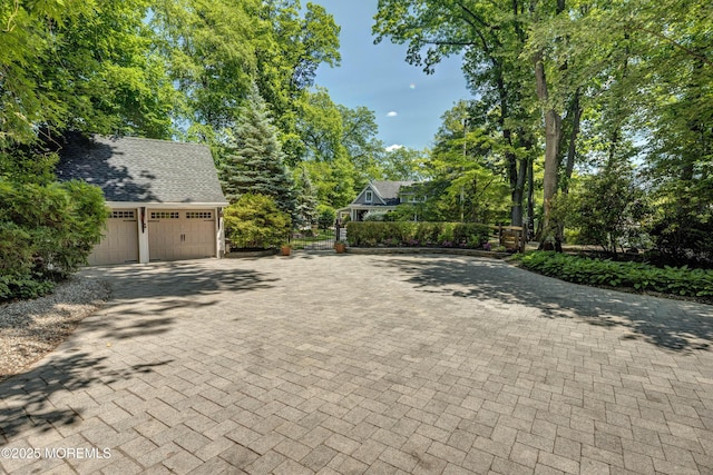 1 Beechwood Ter, Matawan, NJ 07747 - view of decorative driveway featuring view of wooded area