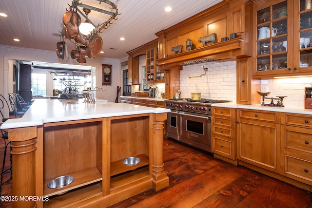 1 Beechwood Ter, Matawan, NJ 07747 - kitchen with range with two ovens, light countertops, brown cabinets, recessed lighting, and ornamental molding