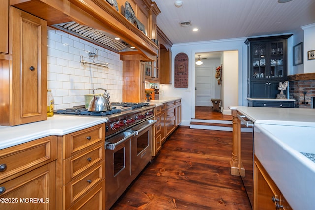 1 Beechwood Ter, Matawan, NJ 07747 - kitchen featuring double oven range, decorative backsplash, glass insert cabinets, light countertops, and dark wood-style floors