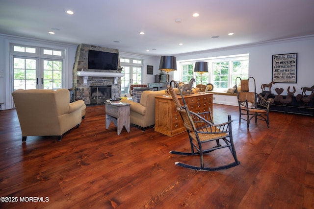 1 Beechwood Ter, Matawan, NJ 07747 - living room featuring ornamental molding, dark wood-style flooring, a stone fireplace, french doors, and recessed lighting