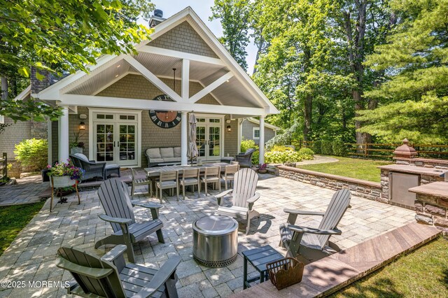 1 Beechwood Ter, Matawan, NJ 07747 - view of patio featuring french doors and an outdoor living space with a fire pit