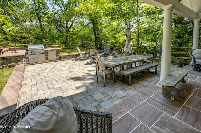1 Beechwood Ter, Matawan, NJ 07747 - view of patio / terrace with outdoor dining area, view of scattered trees, and a sink