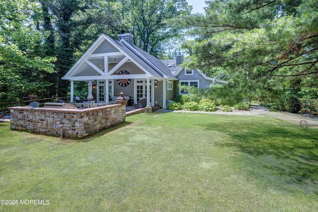 1 Beechwood Ter, Matawan, NJ 07747 - back of property featuring a chimney and a yard