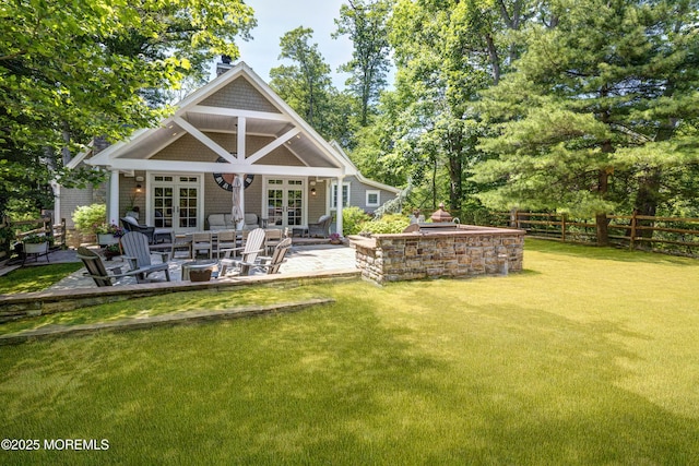 1 Beechwood Ter, Matawan, NJ 07747 - rear view of house featuring french doors, a patio, and an outdoor fire pit