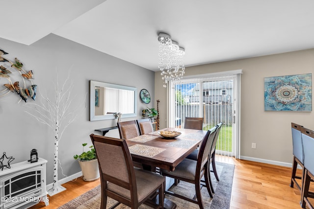 1016 7th Ave, Toms River, NJ 08757 - dining room with light wood-style flooring, a chandelier, and baseboards