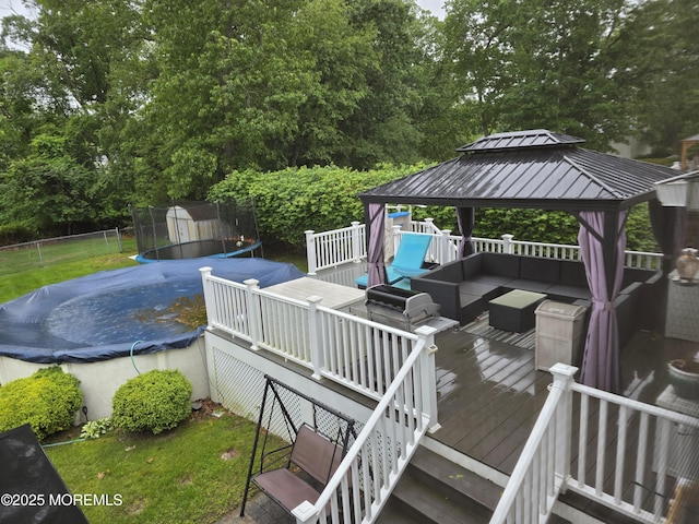 19 Fordham Rd, Jackson, NJ 08527 - wooden deck with a trampoline, outdoor lounge area, a gazebo, and view of scattered trees