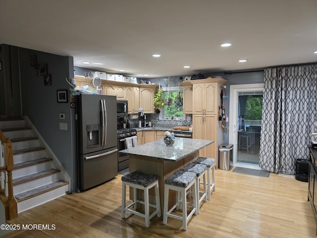 19 Fordham Rd, Jackson, NJ 08527 - kitchen featuring appliances with stainless steel finishes, light wood-type flooring, a kitchen bar, decorative backsplash, and recessed lighting
