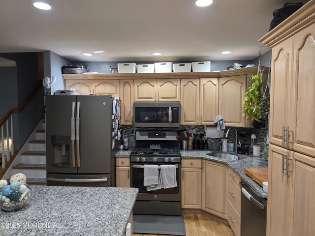 19 Fordham Rd, Jackson, NJ 08527 - kitchen featuring appliances with stainless steel finishes, a sink, light brown cabinetry, tasteful backsplash, and light stone countertops