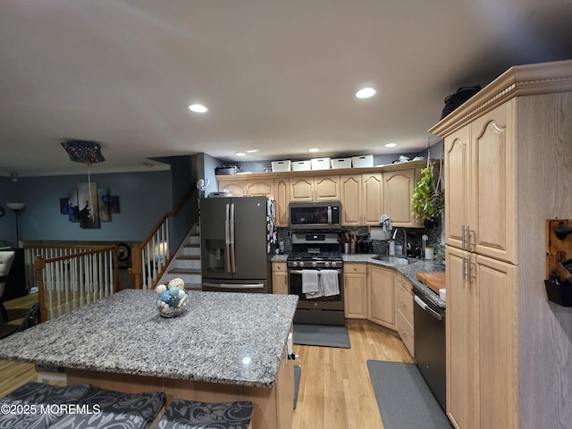 19 Fordham Rd, Jackson, NJ 08527 - kitchen featuring stainless steel appliances, a sink, light wood-style floors, light brown cabinets, and a kitchen island