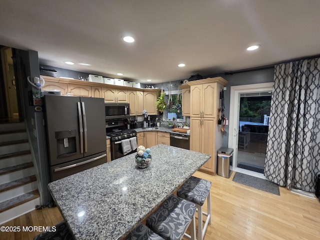 19 Fordham Rd, Jackson, NJ 08527 - kitchen featuring appliances with stainless steel finishes, recessed lighting, light wood-style flooring, light stone countertops, and a center island
