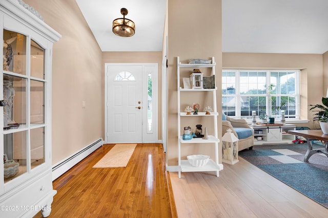 1 Sophia Ct, Toms River, NJ 08757 - entryway with a baseboard radiator, light wood-type flooring, and vaulted ceiling