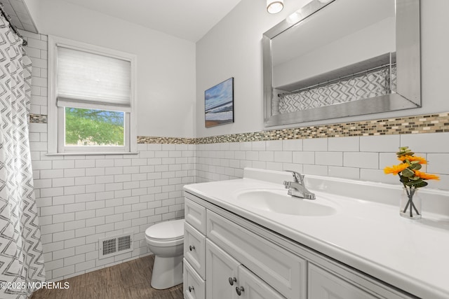 3404 Sandpiper Way, Allenwood, NJ 08720 - full bath with vanity, toilet, tile walls, wood finished floors, and wainscoting