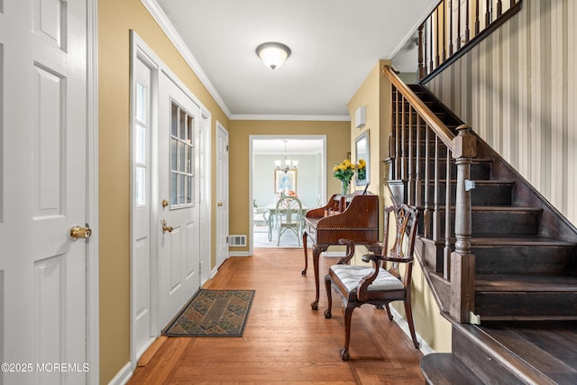 3404 Sandpiper Way, Allenwood, NJ 08720 - foyer entrance featuring stairway, wood finished floors, a chandelier, crown molding, and baseboards
