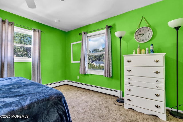 2419 Mallow St, Point Pleasant, NJ 08742 - carpeted bedroom featuring a baseboard heating unit, baseboards, and a ceiling fan