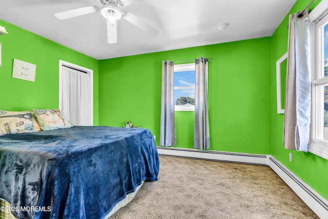 2419 Mallow St, Point Pleasant, NJ 08742 - bedroom with baseboard heating, carpet flooring, and a ceiling fan