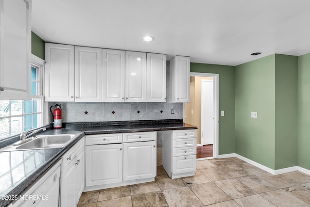 2419 Mallow St, Point Pleasant, NJ 08742 - kitchen with a sink, dishwasher, white cabinets, backsplash, and recessed lighting
