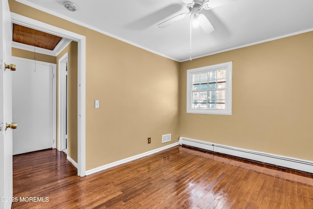 2419 Mallow St, Point Pleasant, NJ 08742 - spare room featuring baseboard heating, hardwood / wood-style floors, ornamental molding, attic access, and a smoke detector