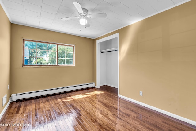2419 Mallow St, Point Pleasant, NJ 08742 - unfurnished bedroom with a baseboard heating unit, hardwood / wood-style flooring, a closet, crown molding, and baseboards