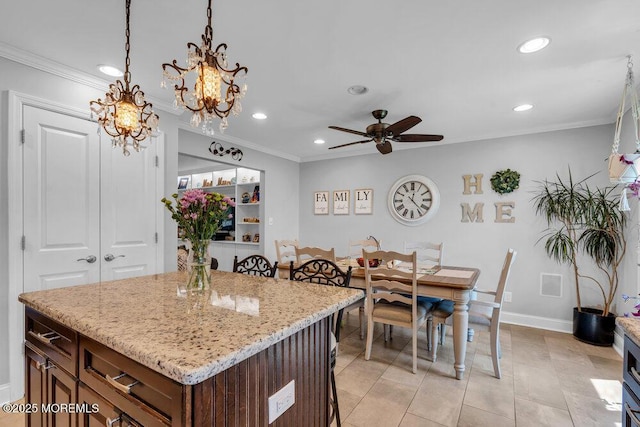 27 Barkalow Ave, Freehold, NJ 07728 - kitchen with recessed lighting, a breakfast bar area, ornamental molding, a ceiling fan, and a chandelier