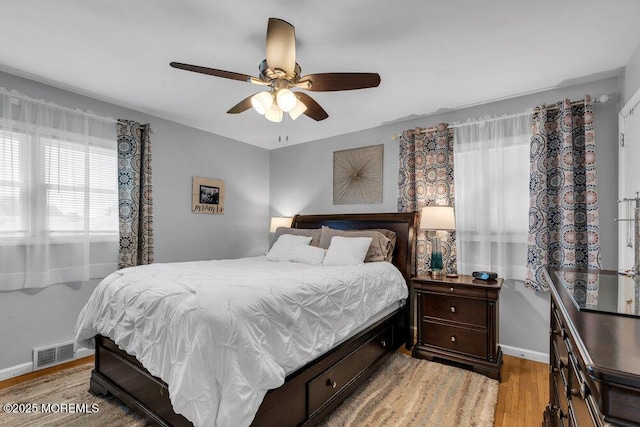 27 Barkalow Ave, Freehold, NJ 07728 - bedroom with light wood-type flooring, baseboards, and a ceiling fan