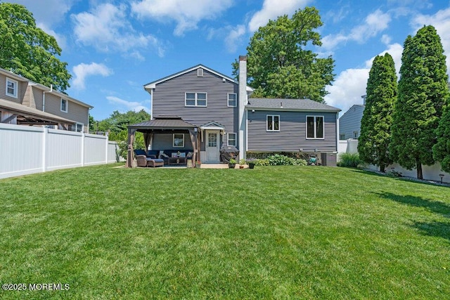 27 Barkalow Ave, Freehold, NJ 07728 - back of property featuring outdoor lounge area, a gazebo, a patio, and a chimney