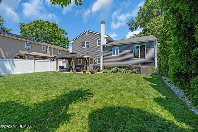 27 Barkalow Ave, Freehold, NJ 07728 - rear view of property with a gazebo, a patio, an outdoor hangout area, a chimney, and cooling unit
